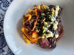The National signature dishes Vegetable Plate, Mezze, Hanger Steak, Seasonal Pastas